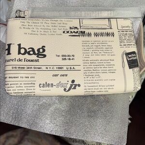 Coach 🆕 newsprint Large Corner Zip Wristlet With Newspaper Print